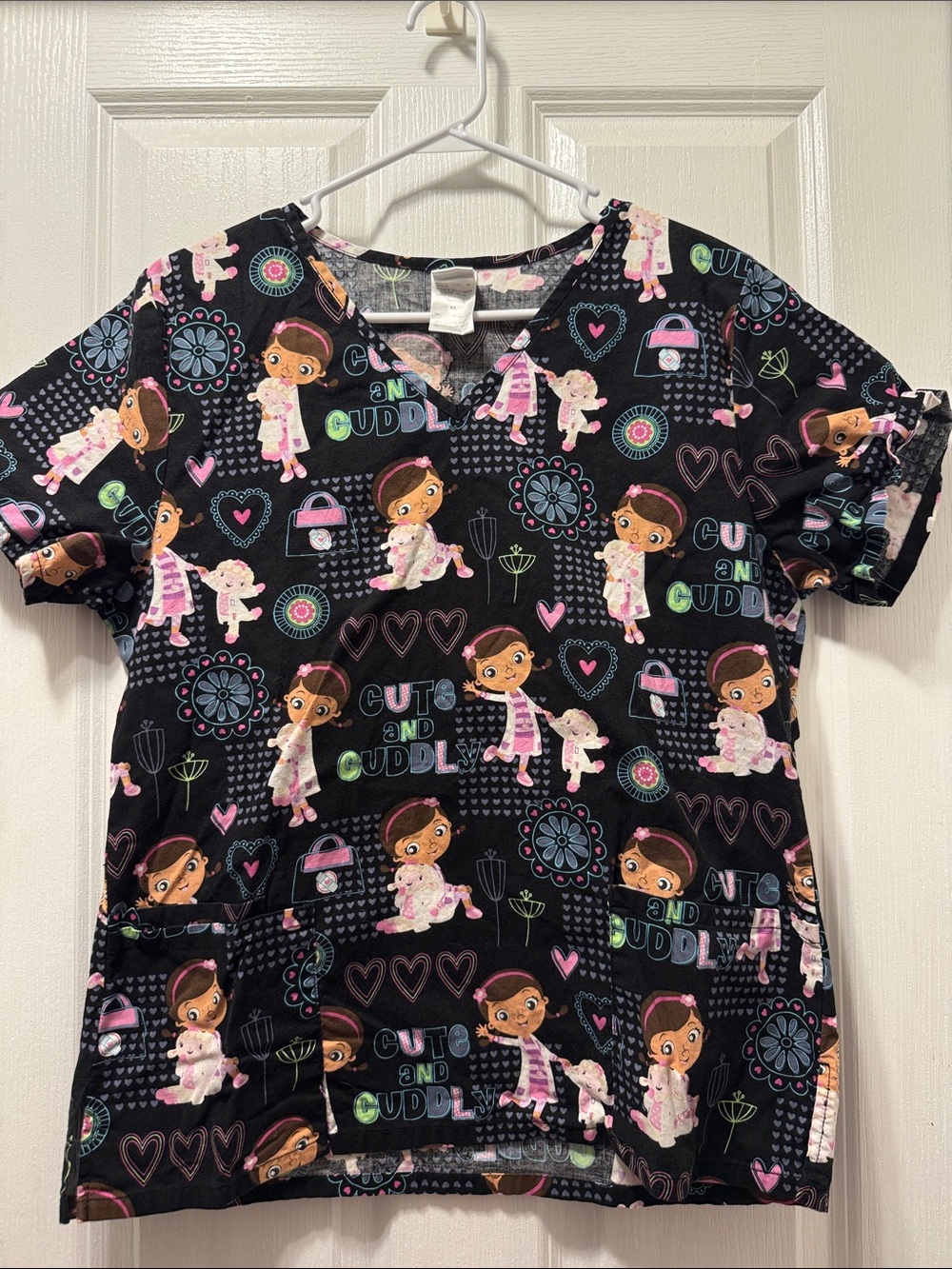 Disney Black 'Cute and Cuddly' Character Print Scrub Top. Doc McStuffins